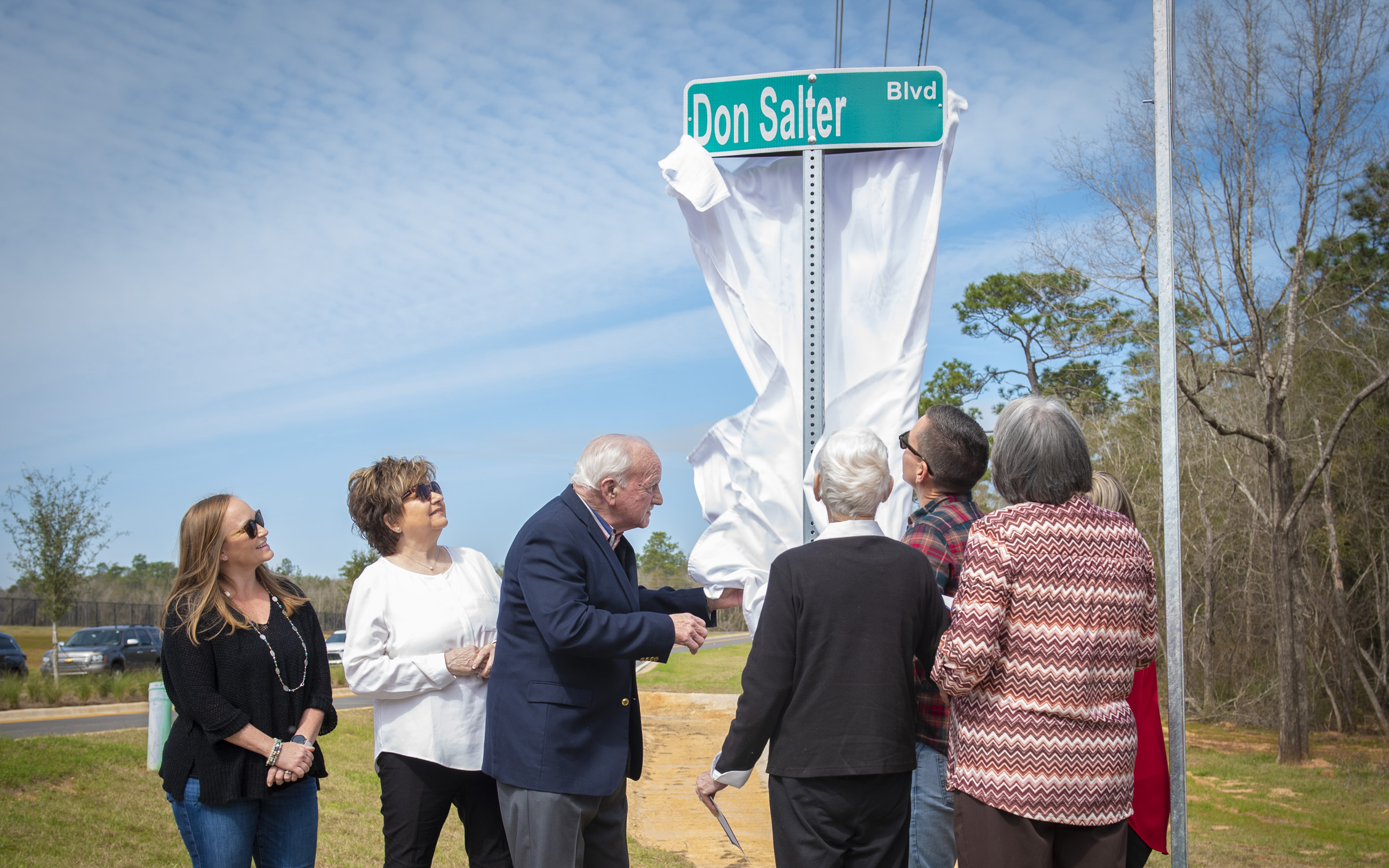 Don Salter and his family unveil the Don Salter Boulevard street sign
